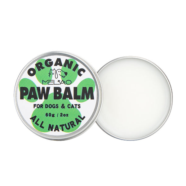 Round aluminium tin of organic paw balm for dogs and cats, 60 g / 2 oz, lid off beside the open tin showing the white balm
