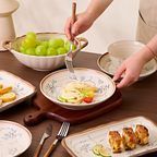 Simple Retro plates and a two-handled bowl set out for a meal. Food and props not included.