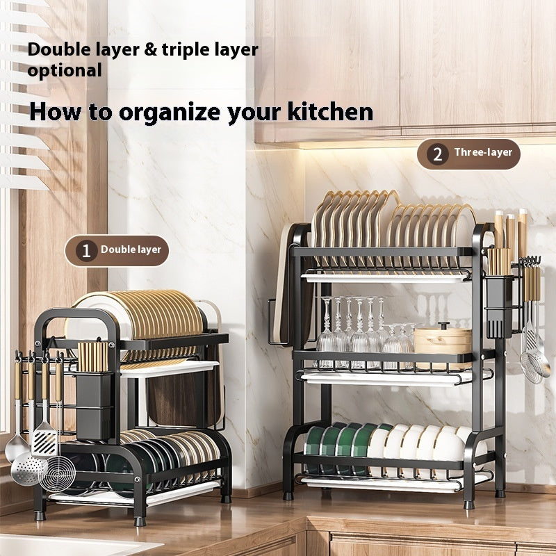 Black 2-tier and 3-tier dish drying racks organizing plates, bowls and utensils on a kitchen counter