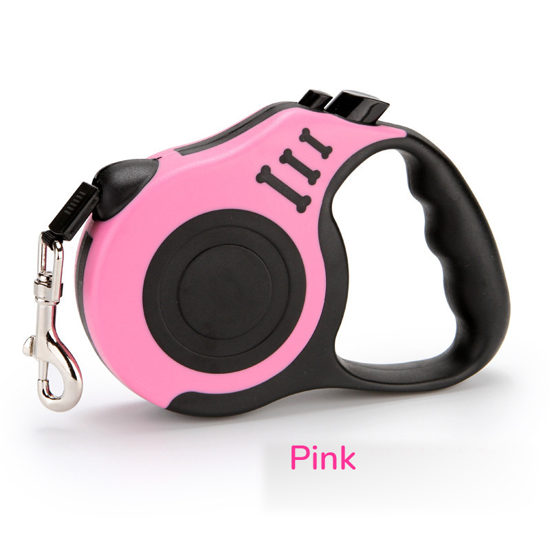 Pink retractable leash with a black grip, side view on white