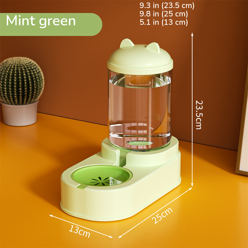 Mint green water dispenser with a green bowl, marked 9.3 in (23.5 cm) tall on a 9.8 x 5.1 in base