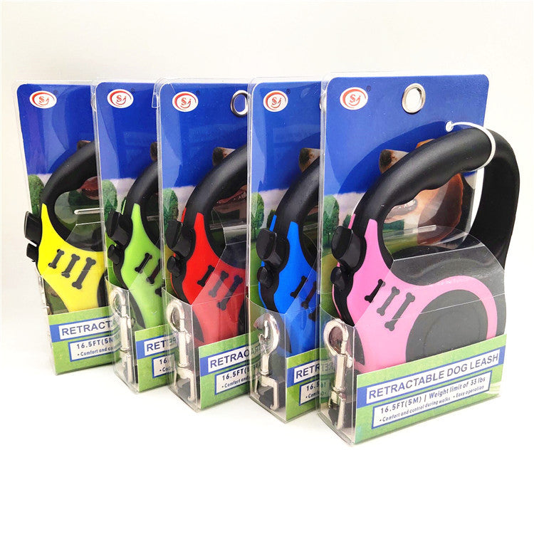 Five retractable leashes in clear retail boxes on white, pink one in front, yellow to blue behind