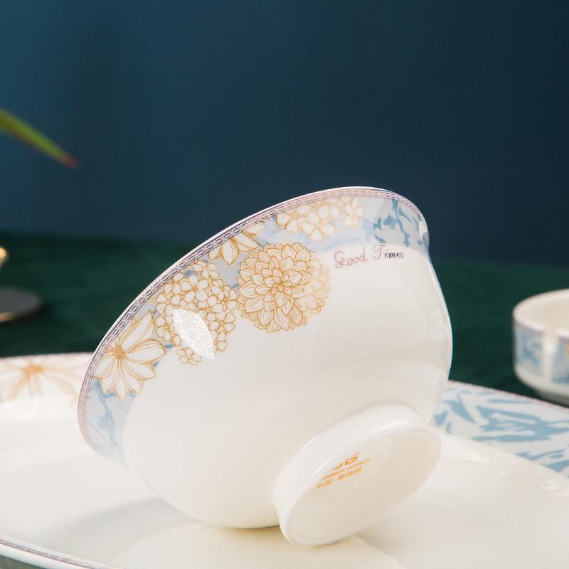 A single bowl tilted to show the patterned rim and the plain glazed foot underneath