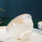 A single bowl tilted to show the patterned rim and the plain glazed foot underneath