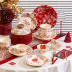 Red Botanical Table Set in a Gift Box. A cream body with a red botanical print that runs across the plates, inside the bowls and over the lid of the covered pot.