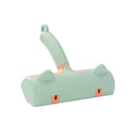 Mint green pet hair remover roller brush with cat-ear details, front view