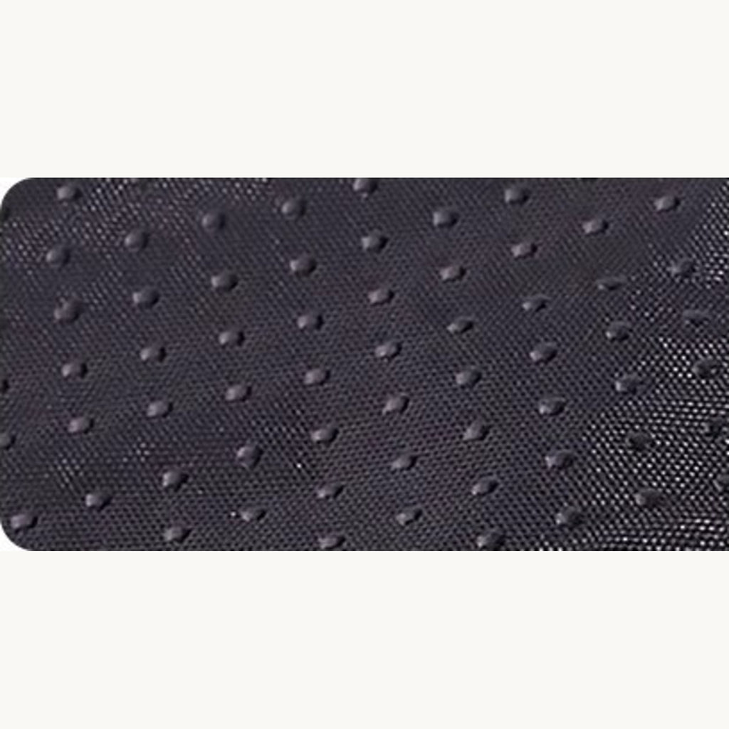 Close-up of the dark dimpled fabric on the underside of the bed
