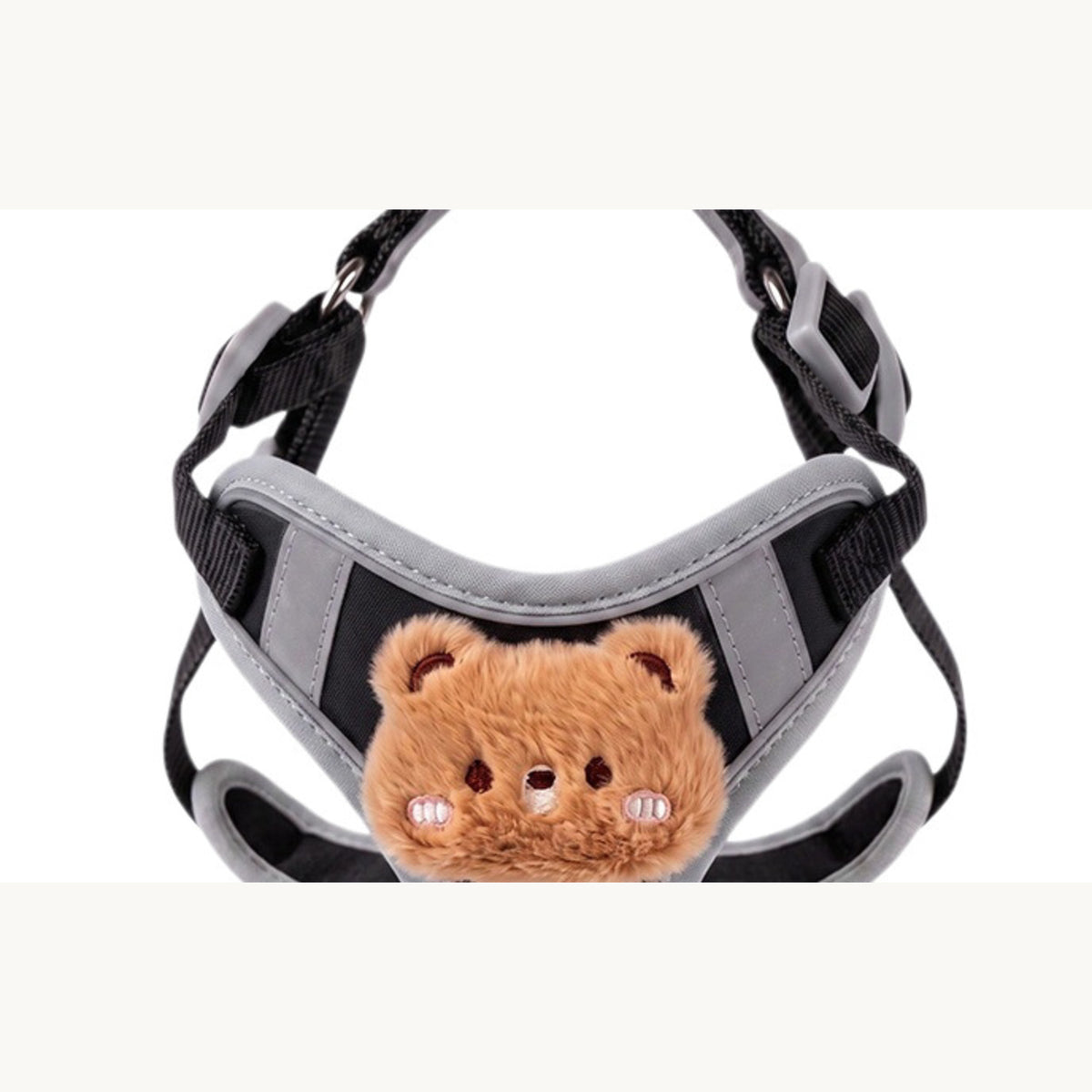 The black harness from the front with both shoulder straps laid open
