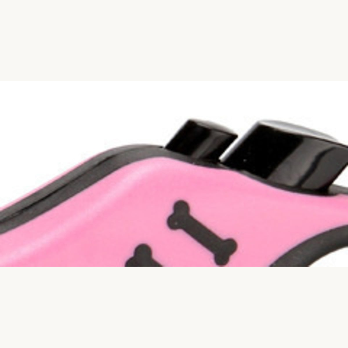 The two black top buttons and an embossed bone on the pink shell