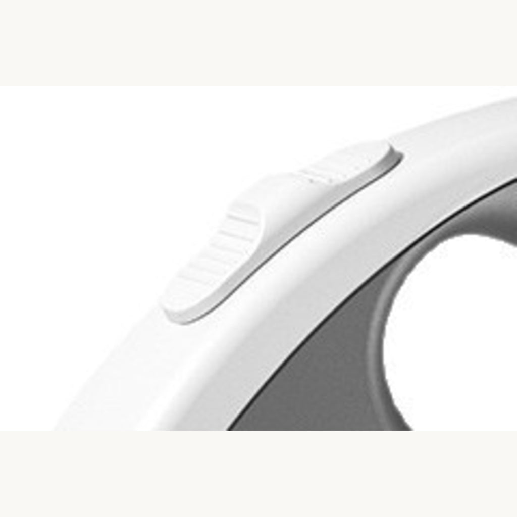 Close-up of the thumb button on the top edge of the white leash shell