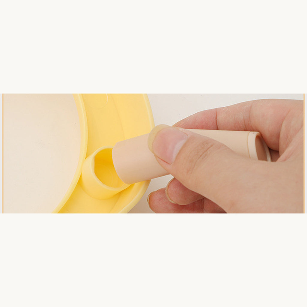 Hand turning a wood-tone leg into the socket under the lemon yellow frame