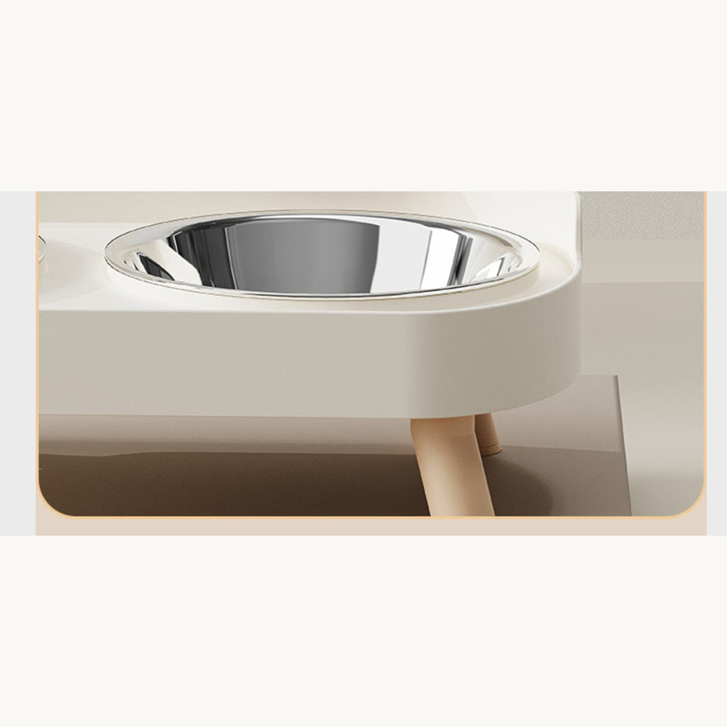Side view of the ivory frame with a steel bowl set in and one leg fitted