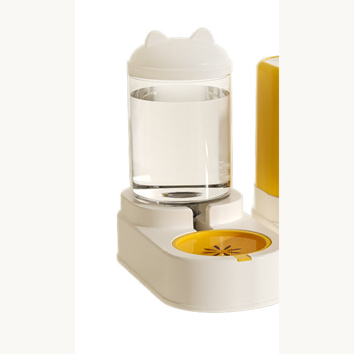 White water dispenser with its filled bottle and the yellow drinking dish
