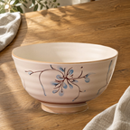 Simple Retro 6 in noodle bowl on a wooden table in soft daylight.