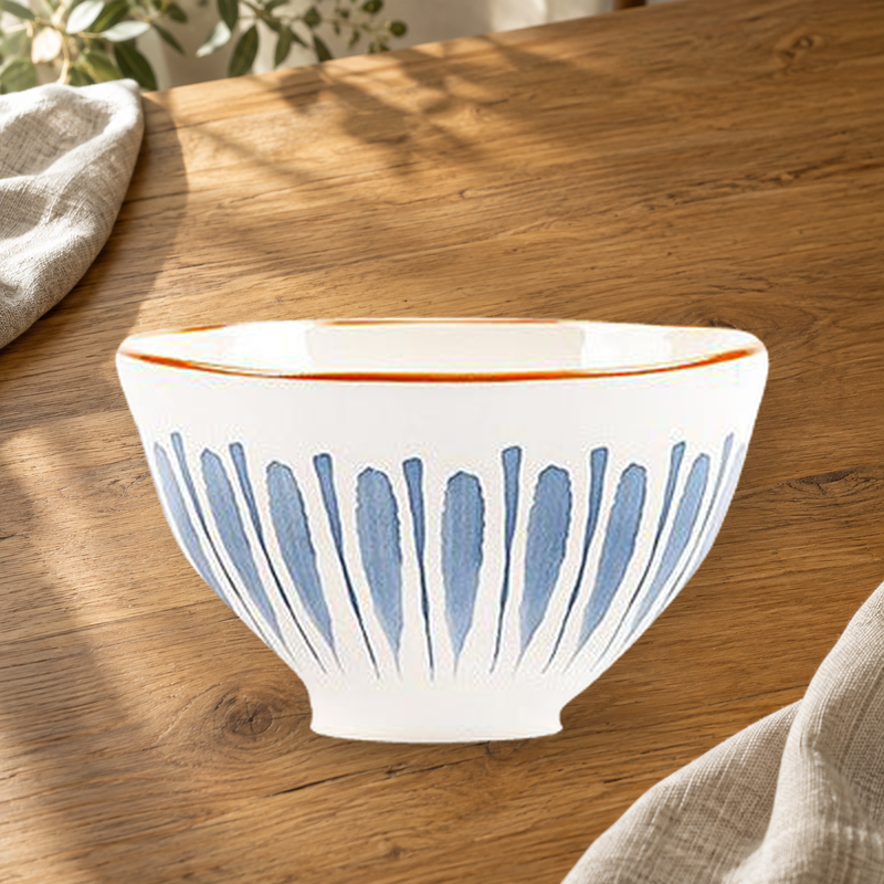Blue Rhyme Thick Retro 4.5 in rice bowl on a wooden table in soft daylight.