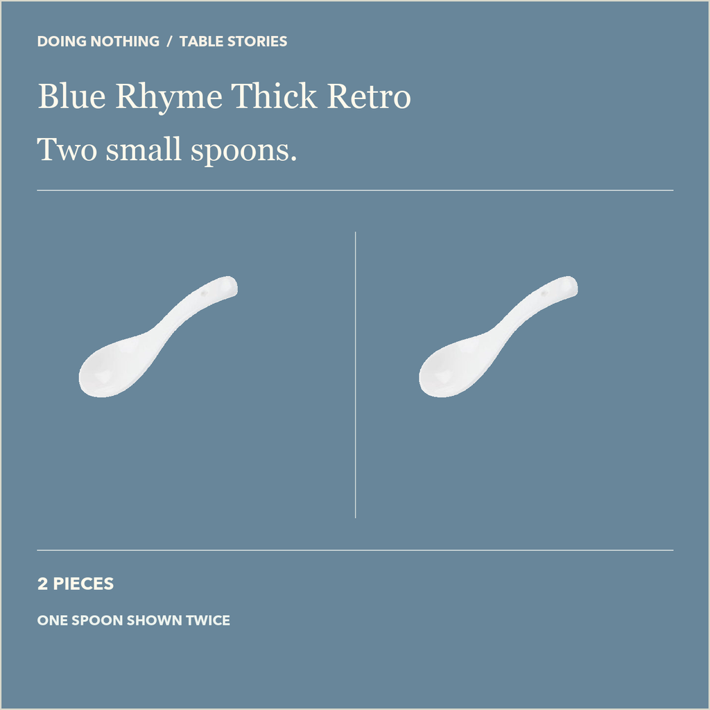 One Blue Rhyme white ceramic small spoon shown twice to illustrate the two-spoon option.