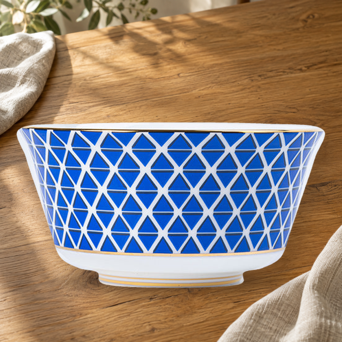 Dongli 4.5 in rice bowl in blue lattice bone porcelain on a wooden table.