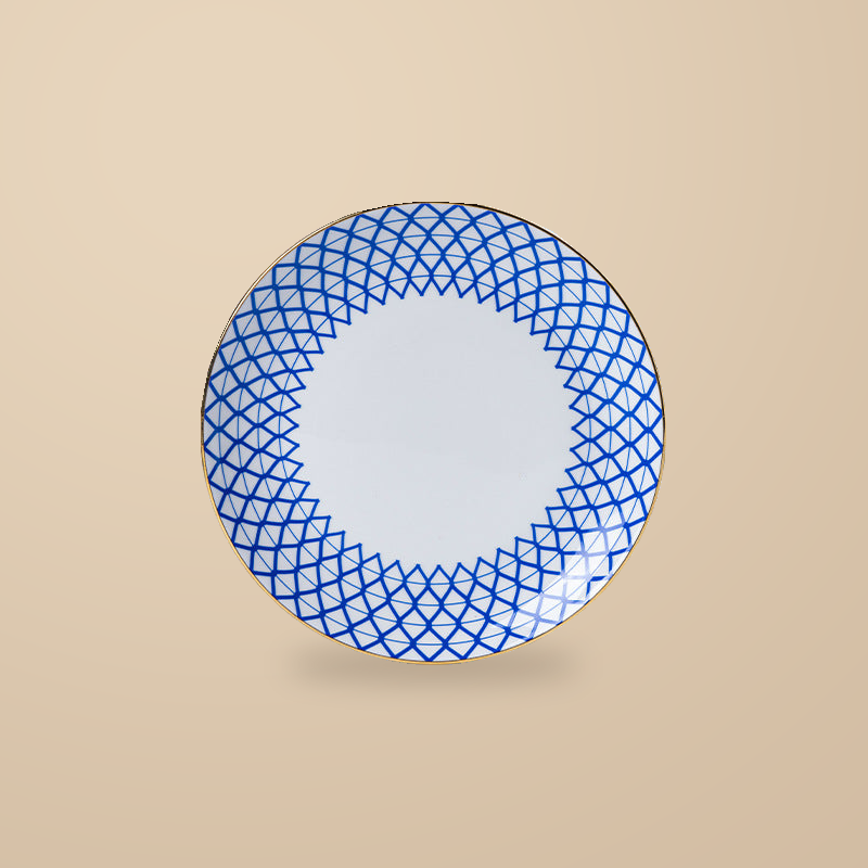 Dongli 6 in side plate in blue lattice bone porcelain with a gold rim.
