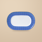 Dongli 12 in oval platter in blue lattice bone porcelain with a gold rim.