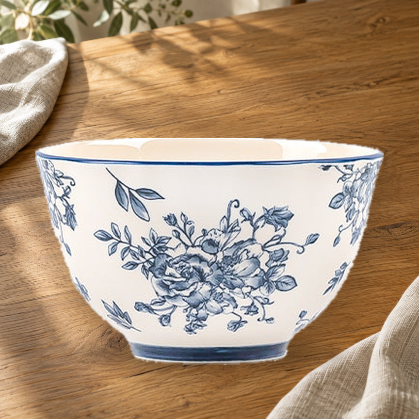 Blue and White Rainy Day 4.5 in rice bowl on a wooden table in soft daylight.