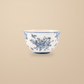 Blue and White Rainy Day 4.5 in rice bowl with a blue floral print, on a warm beige background.