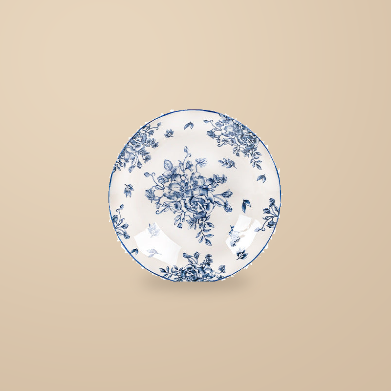 Blue and White Rainy Day 8 in deep plate with a blue floral print, on a warm beige background.