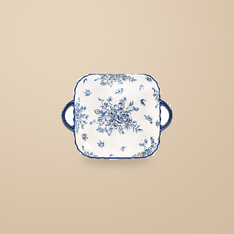 Blue and White Rainy Day square dish with two handles and a blue floral print, on a warm beige background.