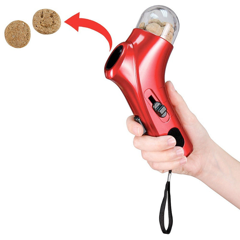 Red handheld pet treat launcher with dry treats