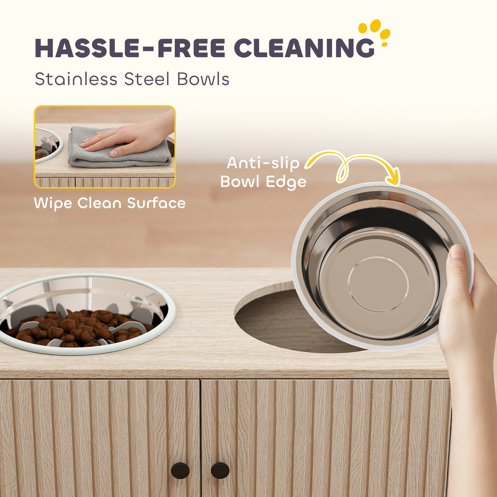 Removable stainless steel bowl lifted out of the station for cleaning