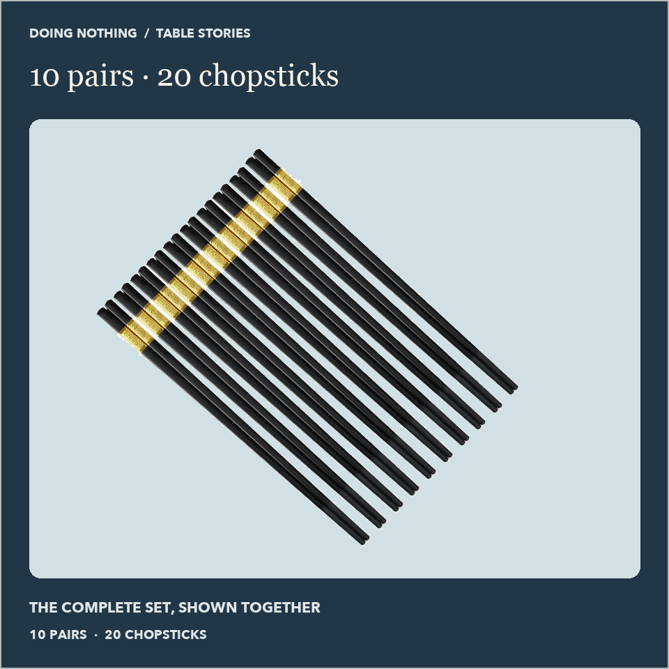 Ten pairs of black alloy chopsticks with gold-color bands, shown together.
