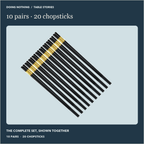 Ten pairs of black alloy chopsticks with gold-color bands, shown together.
