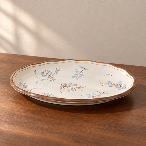 12inch fish plate-1 piece, cream glazed with a hand-painted blue and brown sprig.