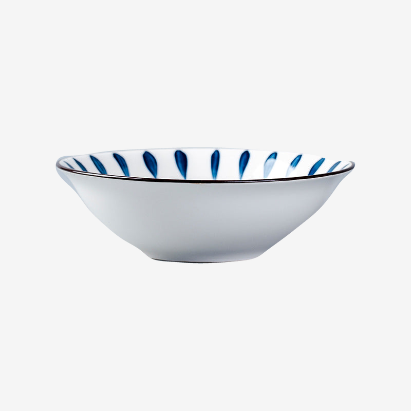 A flared white bowl with blue brushed petals inside the rim, seen from the side.
