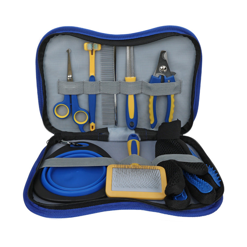 Blue dog grooming kit in its zip carry case with a collapsible bowl, grooming glove, slicker brush, scissors, toothbrush, steel comb, nail file and nail clipper