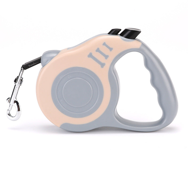 Grey and cream retractable leash with a grey grip, side view on white