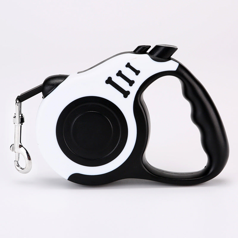 White and black retractable leash with a black grip, side view on white
