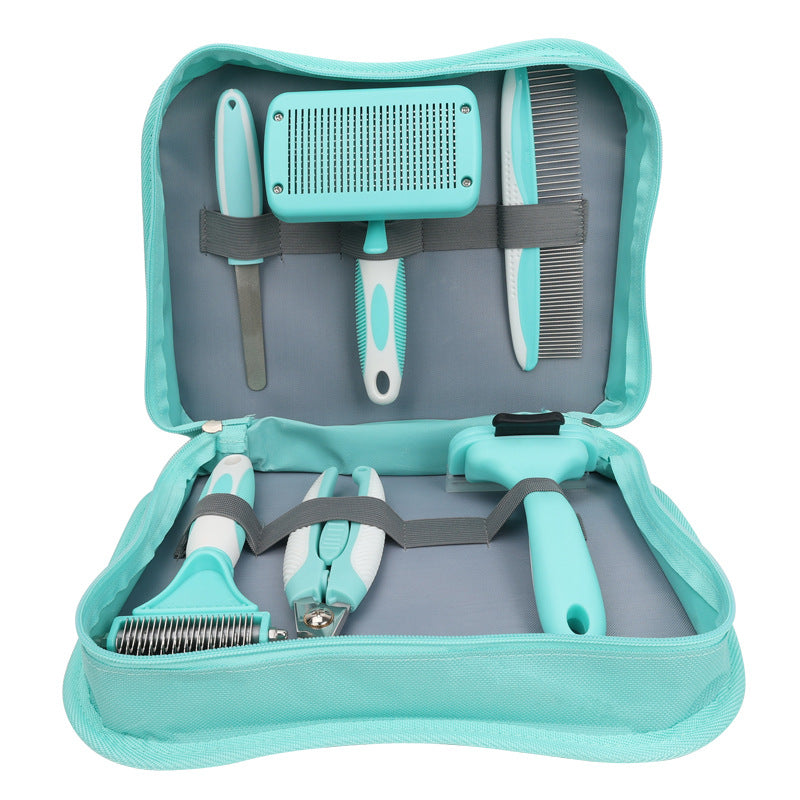 Aqua dog grooming kit in its zip carry case: nail file, self-cleaning slicker brush, steel comb, dematting rake, nail clipper and deshedding tool