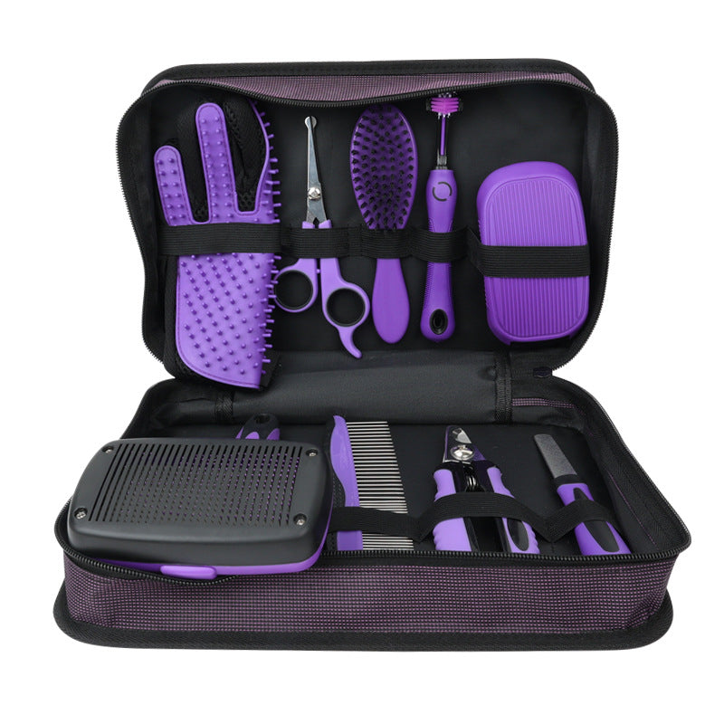 Purple dog grooming kit in its zip carry case: grooming glove, round-tip scissors, bristle brush, toothbrush, silicone bath brush, self-cleaning slicker brush, steel comb, nail clipper and nail file