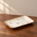 10inch rectangular plate-1 piece, cream glazed with a hand-painted blue and brown sprig.