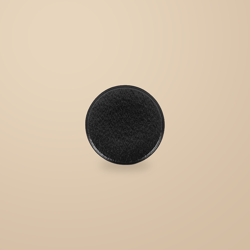 Rock Texture black 8 in dinner plate, on a warm beige background.