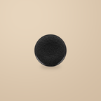 Rock Texture black 8 in dinner plate, on a warm beige background.