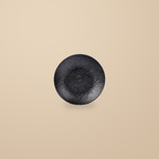Rock Texture black 8 in deep plate, on a warm beige background.