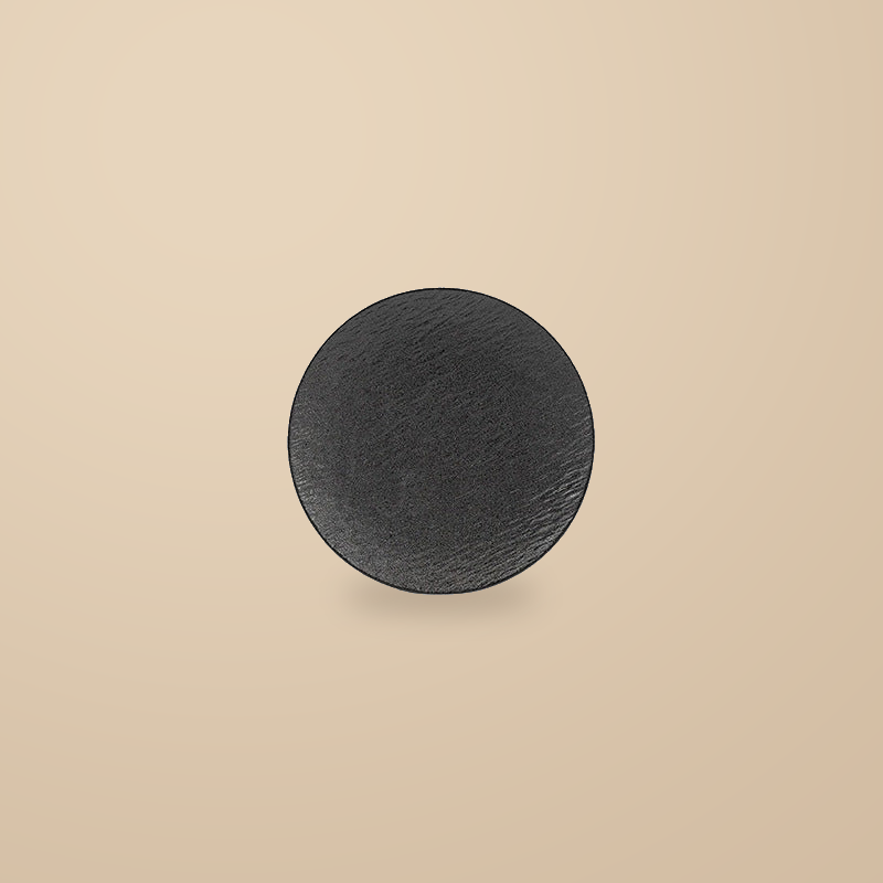 Rock Texture black 10 in plate, on a warm beige background.