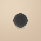 Rock Texture black 10 in plate, on a warm beige background.
