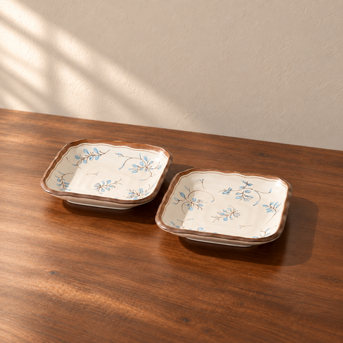 8.5inch square plate-2 pieces, cream glazed with a hand-painted blue and brown sprig.