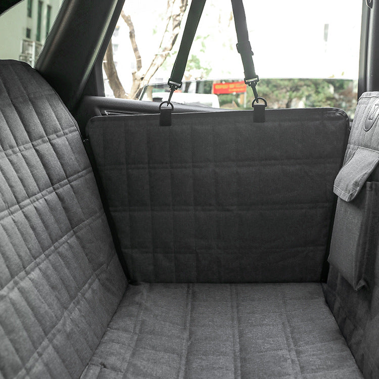 Black dog back seat cover in hammock position behind the front seats