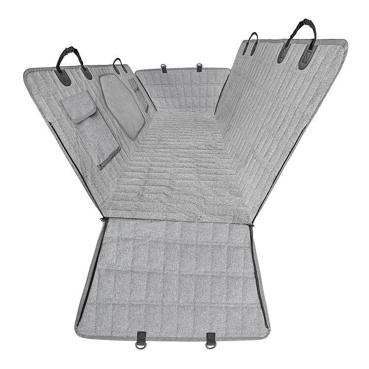 Light gray dog back seat cover laid out showing side flaps, pockets and headrest straps