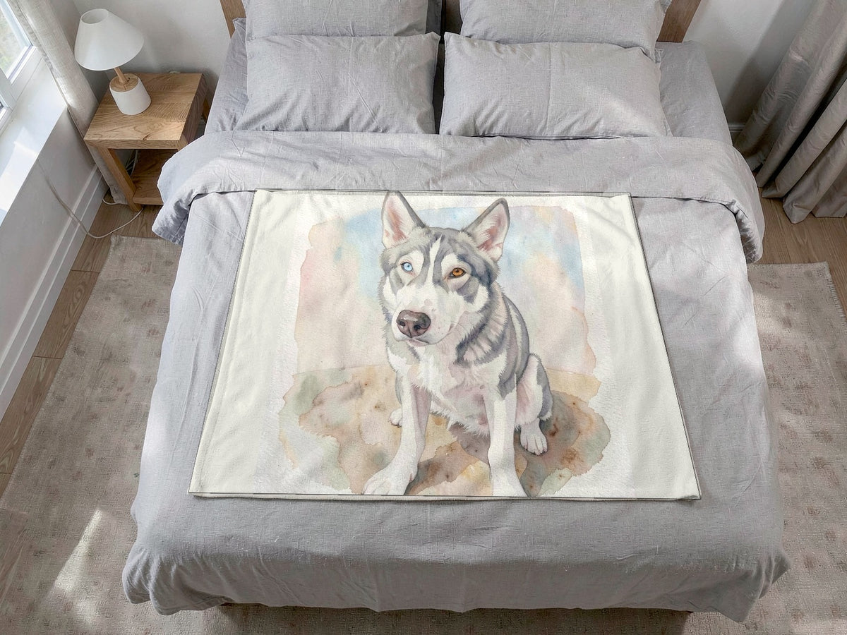 Example dog artwork: a watercolor portrait of a grey and white husky with one blue eye, printed on a fleece blanket on a bed