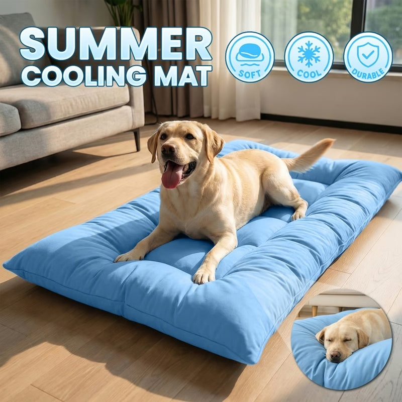 Extra-large light blue quilted dog bed on a living-room floor with a Labrador lying on it