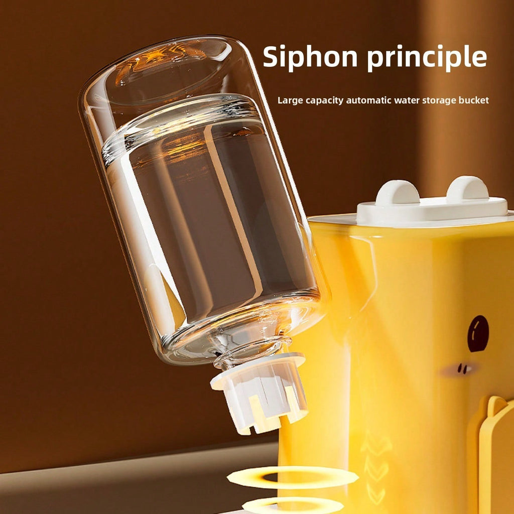 Water bottle held upside down to show the siphon valve that lets water into the dish as the pet drinks (supplier illustration)